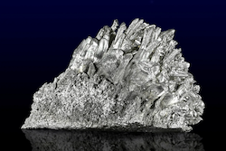Image of silver colored crystalline rock.