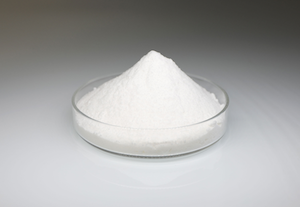 Image of fine white powder in a small glass dish.